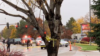 Police close off a street outside a shopping mall after a shooting in Boise, Idaho on Monday, Oct. 25, 2021. Police said there are reports of multiple injuries and one person is in custody.