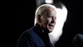 President Joe Biden speaks at a rally for Democratic gubernatorial candidate, former Virginia Gov. Terry McAuliffe, Tuesday, Oct. 26, 2021, in Arlington, Va. McAuliffe will face Republican Glenn Youngkin in the November election.