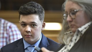 Kyle Rittenhouse waits for his motion hearing to begin with one of his attorneys, Natalie Wisco, at the Kenosha County Courthouse in Kenosha, Wis., in this Oct. 25, 2021 file photo.