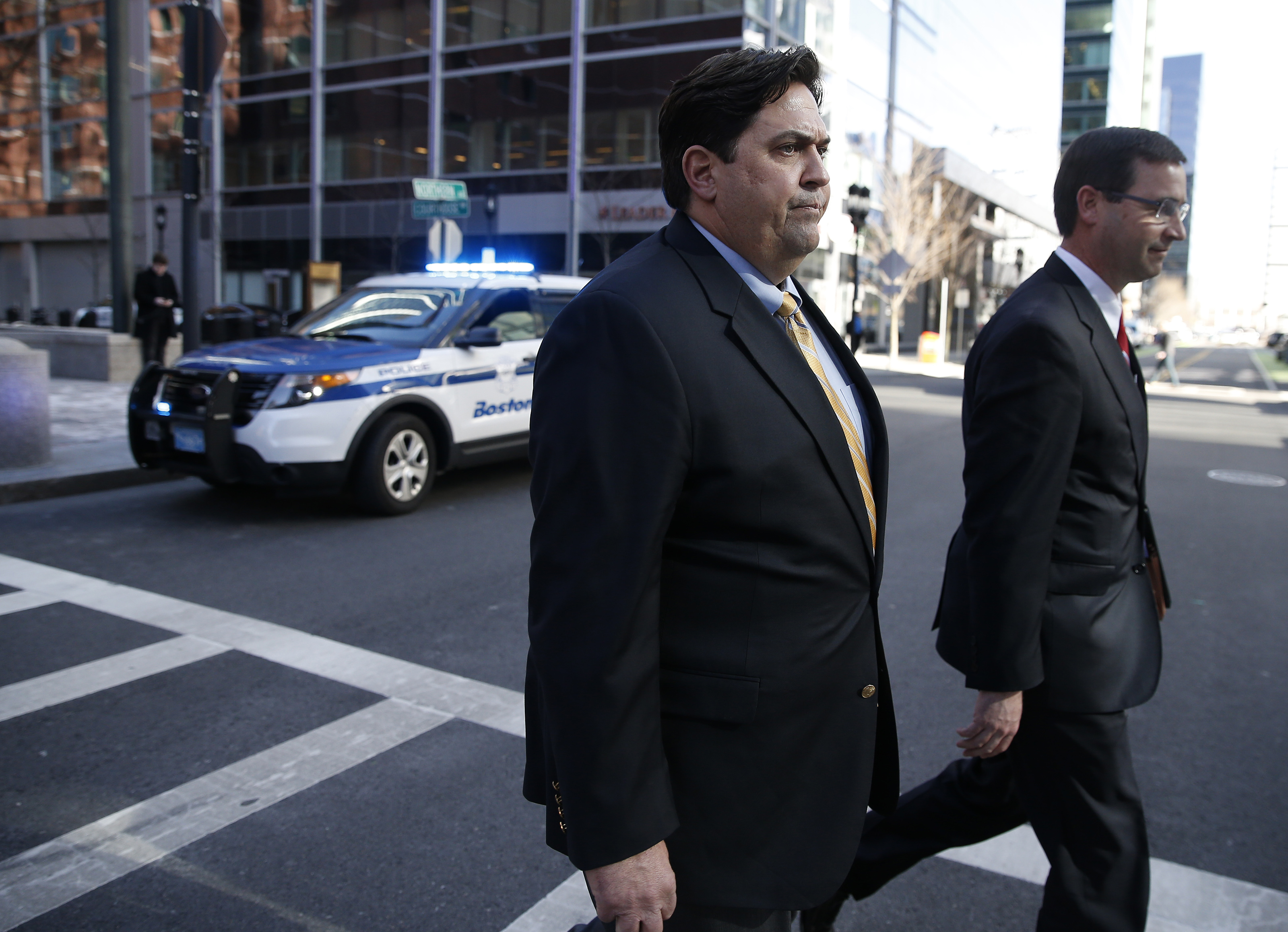 William Ferguson, left, former women's volleyball coach at Wake Forest University, is pictured outside the John Joseph Moakley United State Courthouse in Boston on March 25, 2019.