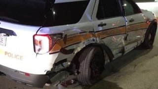 The damaged back-end of an Illinois State Police cruiser is shown after a crash on Interstate 90