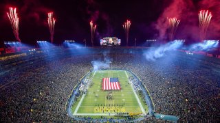 Lambeau Field is pictured at night, with fireworks in the sky, ahead of a playoff game against the Seattle Seahawks