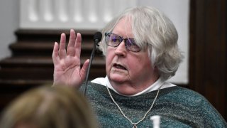 KENOSHA, WISCONSIN – NOVEMBER 05: Susan Hughes, the late Anthony Huber’s great aunt, is sworn in during Kyle Rittenhouse’s trial at the Kenosha County Courthouse on November 5, 2021 in Kenosha, Wisconsin. Rittenhouse is accused of shooting three demonstrators, killing two of them, during a night of unrest that erupted in Kenosha after a police officer shot Jacob Blake seven times in the back while being arrested in August 2020. Rittenhouse, from Antioch, Illinois, was 17 at the time of the shooting and armed with an assault rifle. He faces counts of felony homicide and felony attempted homicide. (Photo by Sean Krajacic-Pool/Getty Images)