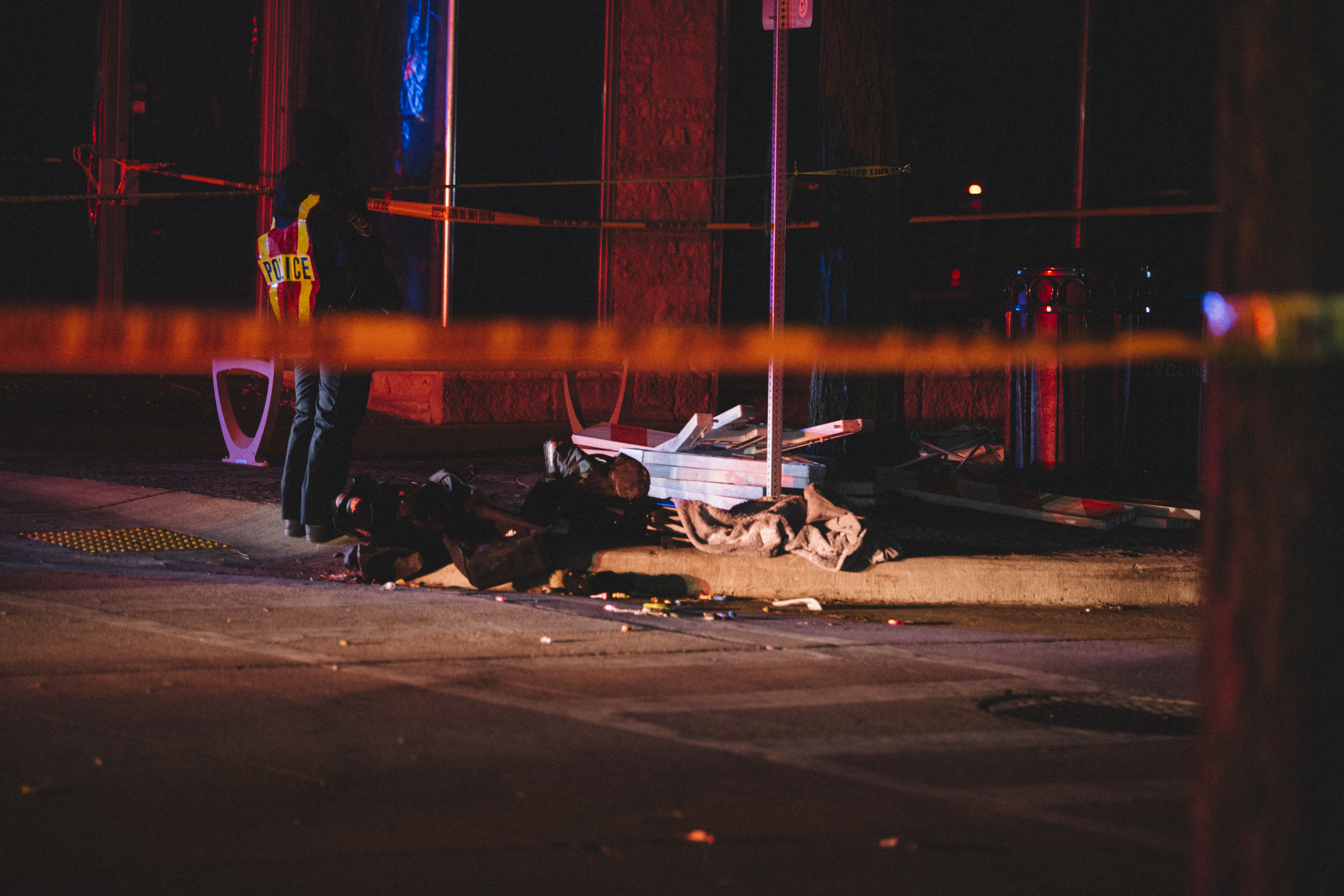 Debris litters a holiday parade route in Waukesha, Wisconsin, Nov. 21, 2021. An SUV plowed into parade performers Sunday afternoon, killing five and injuring 40 others.