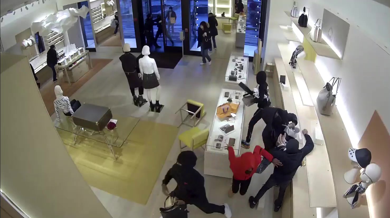 14 people robbed a Louis Vuitton store of at least 100000 in merchandise  police say