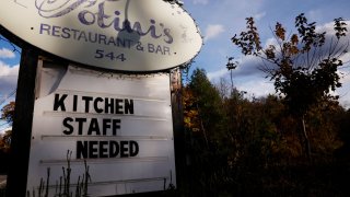 A sign reads “Kitchen Staff Needed” outside Fotini’s Restaurant and Bar in Bolton, Massachusetts, November 4, 2021.