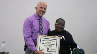 The Muskogee Public Schools Board of Education recognized sixth-grader Davyon Johnson for his heroic acts during the board meeting Dec. 14, 2021.