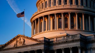 Light from the morning sun illuminates the Capitol in Washington