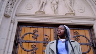 Nathalie Charles poses for a portrait outside the Princeton University Chapel