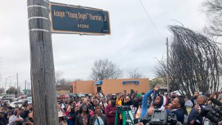 A street sign is unveiled to honor slain rapper Young Dolph, whose real name is Adolph Thornton Jr., on Wednesday, Dec. 15, 2021, in Memphis, Tenn.