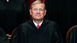 FILE - In this April 23, 2021, file photo Chief Justice John Roberts sits during a group photo at the Supreme Court in Washington. The Supreme Court on Friday rejected a plea from South Carolina to reimpose the death penalty on a South Carolina inmate whose death sentence stood for two decades until a federal appeals court threw it out in August. Chief Justice John Roberts did not comment in denying the state's request to stop the clock on a lower court order in favor of inmate Sammie Lee Stokes.