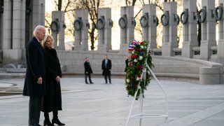 President Joe Biden and first lady Jill Biden visit the National World War II Memorial to mark the 80th anniversary of the Japanese attack on Pearl Harbor, Tuesday, Dec. 7, 2021, in Washington.