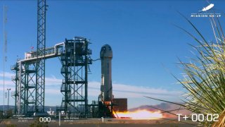 This photo provided by Blue Origin shows, Blue Origin's New Shepard rocket lifts off carrying TV celebrity and former NFL football great Michael Strahan along with other passengers from its spaceport near Van Horn, Texas