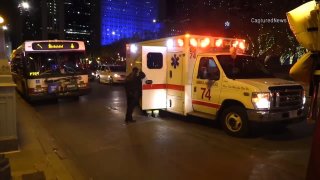 A Chicago ambulance sits near the scene of an assault against a CTA bus driver on Dec. 4, 2021.