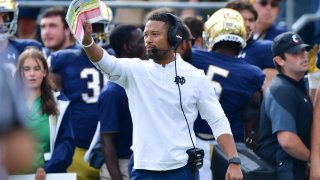 Oct 2, 2021; South Bend, Indiana, USA; Notre Dame Fighting Irish Defensive Coordinator Marcus Freeman signals to his players in the second quarter against the Cincinnati Bearcats at Notre Dame Stadium. Mandatory Credit: Matt Cashore-USA TODAY Sports