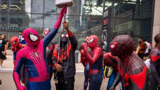 Attendees dressed as Spider-Man gather during New York Comic Con at the Jacob K. Javits Convention Center on Saturday, Oct. 9, 2021, in New York