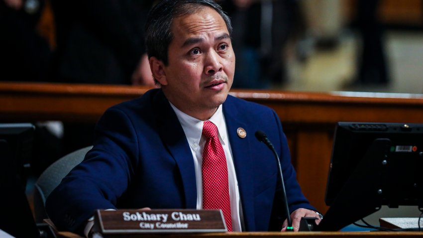 Lowell, MA – December 21: Lowell City Councilor Sokhary Chau, far right, attends a city council meeting in Lowell, MA on December 21, 2021. Chau, who will likely be the nation’s first Cambodian-American mayor, will be one of three Cambodian-American Lowell City Councilors in the upcoming year. The new wave also includes the first mixed-race councilor, Corey Robinson, and first Black school committee member, Stacey Thompson. (Photo by Erin Clark/The Boston Globe via Getty Images)