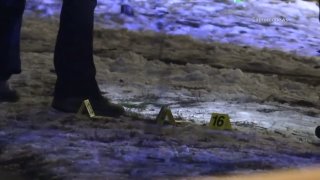 Evidence markers are seen at the location where a pregnant Chicago woman was shot and killed in the Englewood neighborhood on Jan. 12, 2022.