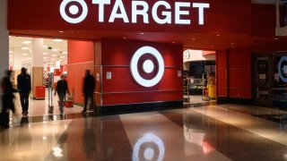 Shoppers enter a Target store in Washington, DC, on February 17, 2022.