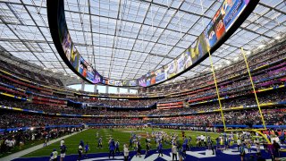 The Los Angeles Rams and Cincinnati Bengals warm up before the NFL Super Bowl 56 football game, Sunday, Feb. 13, 2022, in Inglewood, Calif.