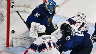 USA’s Amanda Kessel (R) scores a goal past Finland’s goaltender Anni Keisala during their women’s preliminary round group A match of the Beijing 2022 Winter Olympic Games ice hockey competition, at the Wukesong Sports Centre in Beijing on February 3, 2022. (Photo by ANTHONY WALLACE / AFP) (Photo by ANTHONY WALLACE/AFP via Getty Images)