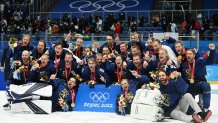 Finlands players pose with their gold medals after the Men's Hockey gold medal match of the 2022 Winter Olympics between Finland and Russia's Olympic Committee, at the National Indoor Stadium in Beijing, China on Feb. 20, 2022.