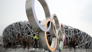 An Olympic Games logo is seen in front of Beijing's National Stadium