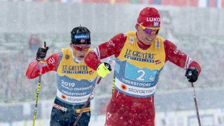  Alexander Bolshunov of Russia in action, takes 2nd place, Johannes Hoesflot Klaebo of Norway in action, takes 1st place during the FIS Nordic World Ski Championships Men's Cross Country 4x10 km Relay