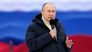 Russian President Vladimir Putin delivers a speech during a concert marking the eighth anniversary of Russia’s annexation of Crimea at Luzhniki Stadium in Moscow, Russia March 18, 2022.