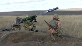 Ukrainian soldiers use a launcher with US Javelin missiles