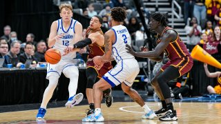 ST. LOUIS, MO – MARCH 06: Loyola-Chicago Ramblers guard Lucas Williamson (1) reaches in and knocks away they pass from Drake Bulldogs forward Tremell Murphy (2) to Drake Bulldogs guard Tucker Devries (12) in the championship game of the Missouri Valley Conference Tournament between the Loyola Chicago Ramblers and the Drake Bulldogs on March 06, 2022, at the Enterprise Center in St. Louis MO (Photo by Rick Ulreich/Icon Sportswire via Getty Images)