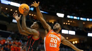PITTSBURGH, PA – MARCH 20: Taze Moore #4 of the Houston Cougars drives past Da’Monte Williams #20 of the Illinois Fighting Illini during the second round of the 2022 NCAA Men’s Basketball Tournament held at PPG PAINTS Arena on March 20, 2022 in Pittsburgh, Pennsylvania. (Photo by Justin K. Aller/NCAA Photos via Getty Images)