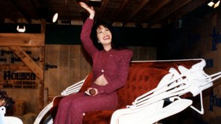 American singer Selena (born Selena Quintanilla-Perez, 1971 - 1995) rides in a carriage during a performance at the Houston Livestock Show & Rodeo at the Houston Astrodome, Houston, Texas, February 26, 1995.