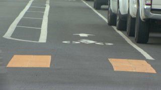 A graphic on a San Diego street guides bicyclists to their dedicated lane in this undated image.