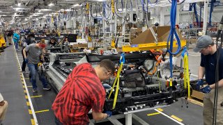 Production of electric Rivian R1T pickup trucks on April 11, 2022 at the company’s plant in Normal, Ill.