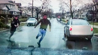 A TV display shows video evidence of a Grand Rapids police officer struggling with and shooting Patrick Lyoya at Grand Rapids City Hall on Wednesday, April 13, 2022.