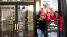 Natasha Tyssen (left), store manager at Circle K in Marseilles, takes a celebratory photo with a few of her staff after selling a million winning Powerball ticket.