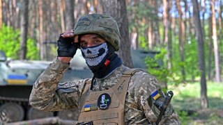 A Ukrainian serviceman looks over during an exercise not far from the second largest Ukrainian city of Kharkiv on April 30, 2022.