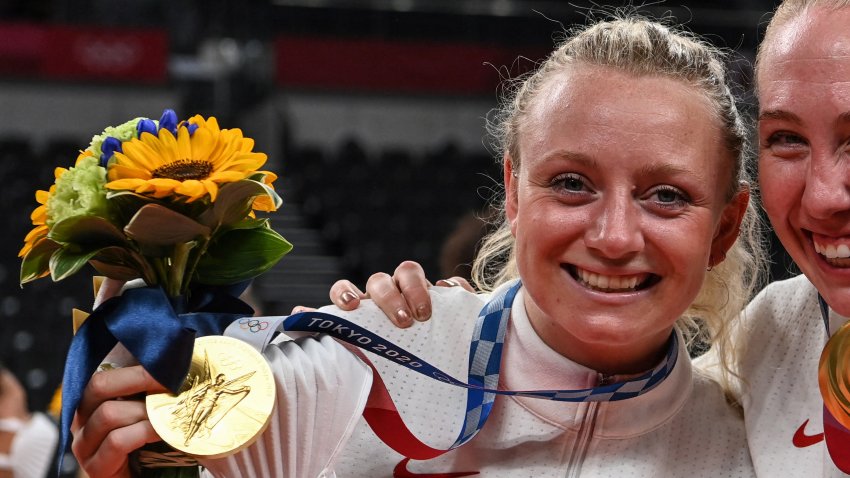 (L-R) USA’s Jordyn Poulter and Michelle Bartsch-Hackley pose with their gold medals during the women’s volleyball victory ceremony during the Tokyo 2020 Olympic Games at Ariake Arena in Tokyo on August 8, 2021. (Photo by YURI CORTEZ / AFP) (Photo by YURI CORTEZ/AFP via Getty Images)