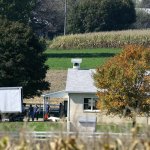 Investigators search the one-room West Nickel Mines Amish Schoo