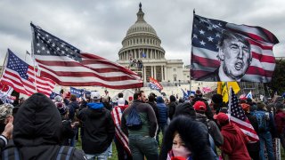 US President Donald Trump’s supporters gather outside the Capitol building, January 6, 2021.
