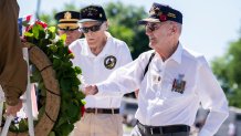 World War II veterans Harry F. Miller, right, who served in the Battle of the Bulge with the 740th Tank Battalion, and Dixon Hemphill, who served in the Navy, lay a wreath during a ceremony to celebrate the 78th anniversary of D-Day at the National World War II Memorial on Monday, June 6, 2022. (Tom Williams/CQ-Roll Call, Inc via Getty Images)