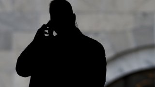 A member of the US Secret Service speaks on a cellphone as US President-elect Donald Trump attends meetings at the US Capitol in Washington, DC, November 10, 2016.
