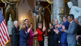 Kansas Governor Laura Kelly, center, is joined by Speaker Nancy Pelosi, D-Calif.,