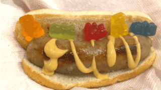 The "Gummy Bear Brat," featuring a gummy bear-infused bratwurst topped with honey mustard and more candy, is one of 80 new food items available at the Wisconsin State Fair this year.