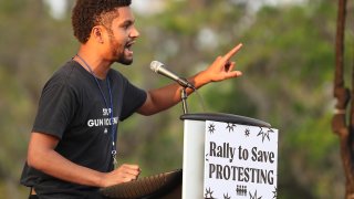 Maxwell Frost, National Organizing Director for March For Our Lives, speaks during a March For Our Lives Florida drive-in rally and aid event at Tinker Field in Orlando on Friday, March 26, 2021.