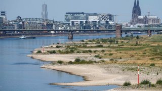 The river Rhine is pictured with low water in Cologne, Germany, Wednesday, Aug. 10, 2022.