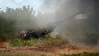 Ukrainian soldiers fire at Russian positions from a U.S.-supplied M777 howitzer in Ukraine’s eastern Donetsk region Saturday, June 18, 2022.