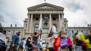 Abortion rights protesters march outside the Indiana State Capitol building on July 25, 2022 in Indianapolis, Indiana. Activists are gathering during a special session of the Indiana state Senate concerning abortion access in the state. (Photo by Jon Cherry/Getty Images)