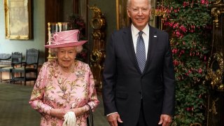 Queen Elizabeth II with US President Joe Biden in the Grand Corridor during their visit to Windsor Castle on June 13, 2021 in Windsor, England.